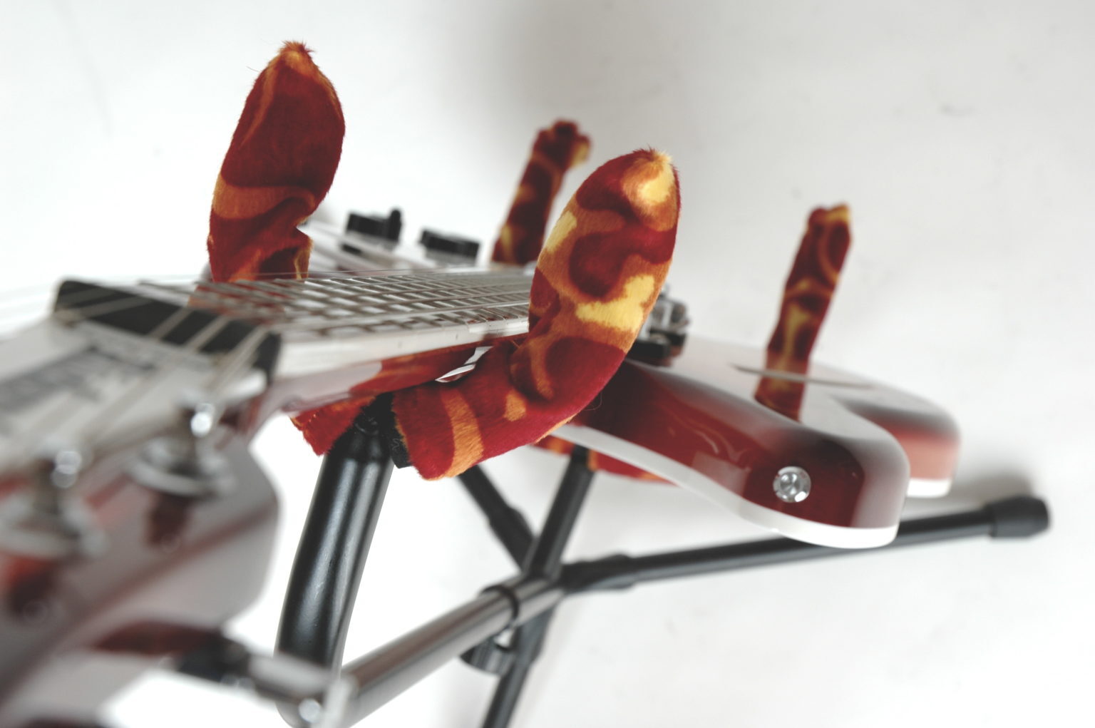 A custom flame-fabric Axe Hugger fitted to a stand.