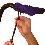 Pulling the draw cord snug.